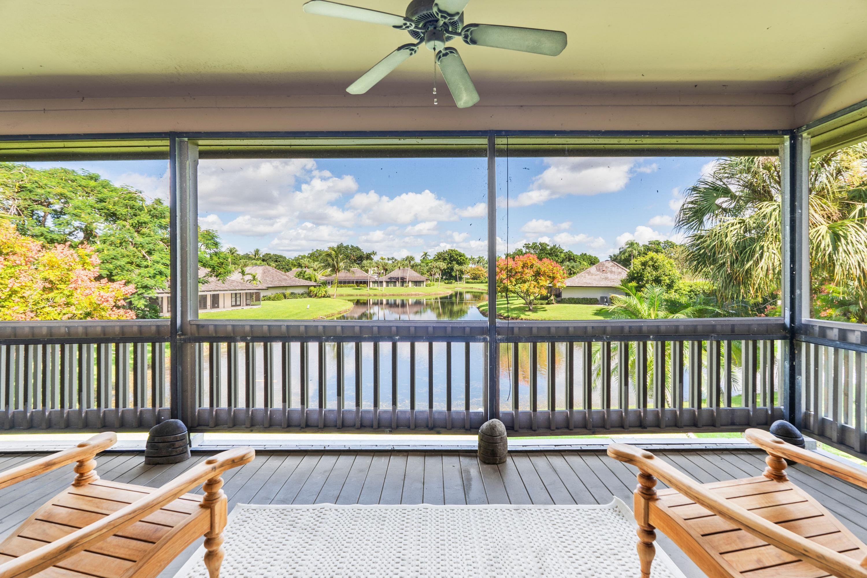 a view of balcony with wooden floor