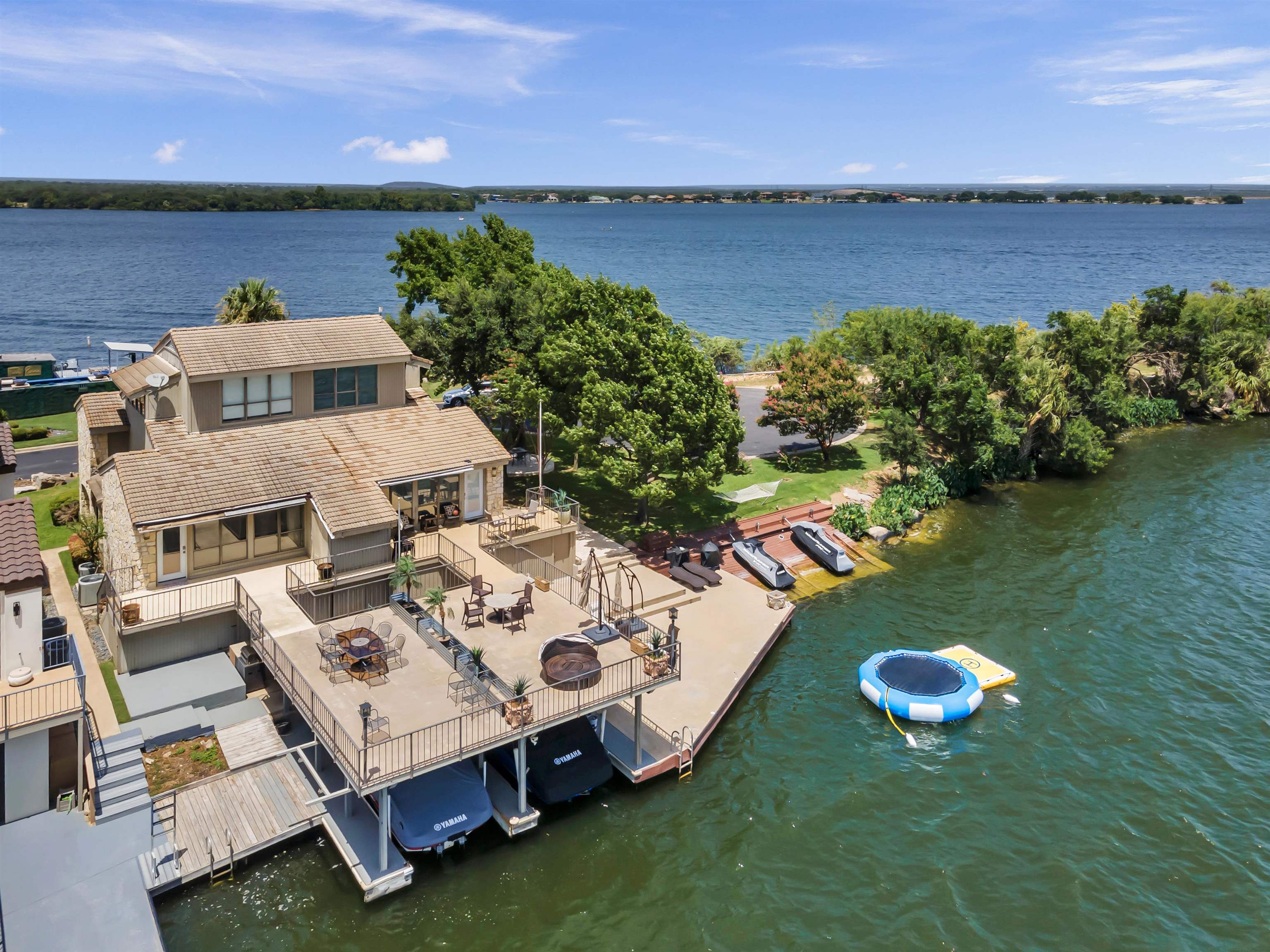 an aerial view of a house with a garden lake view