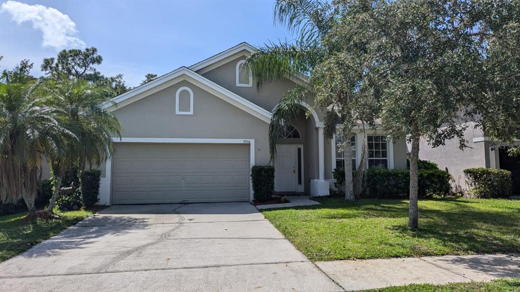 front view of a house with a yard