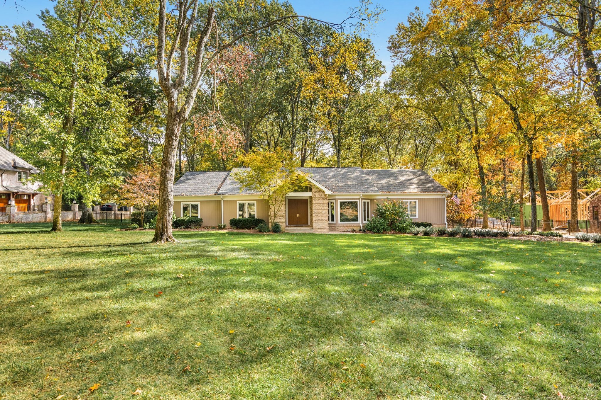 a front view of a house with a garden