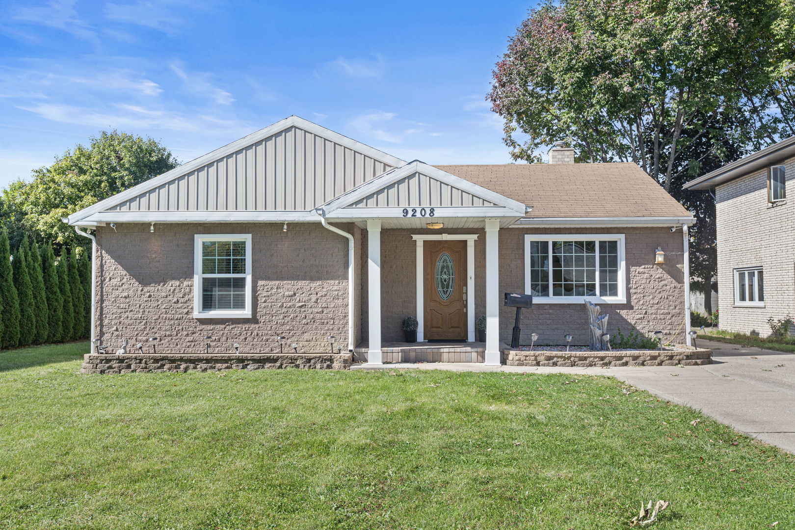 front view of a house with a yard