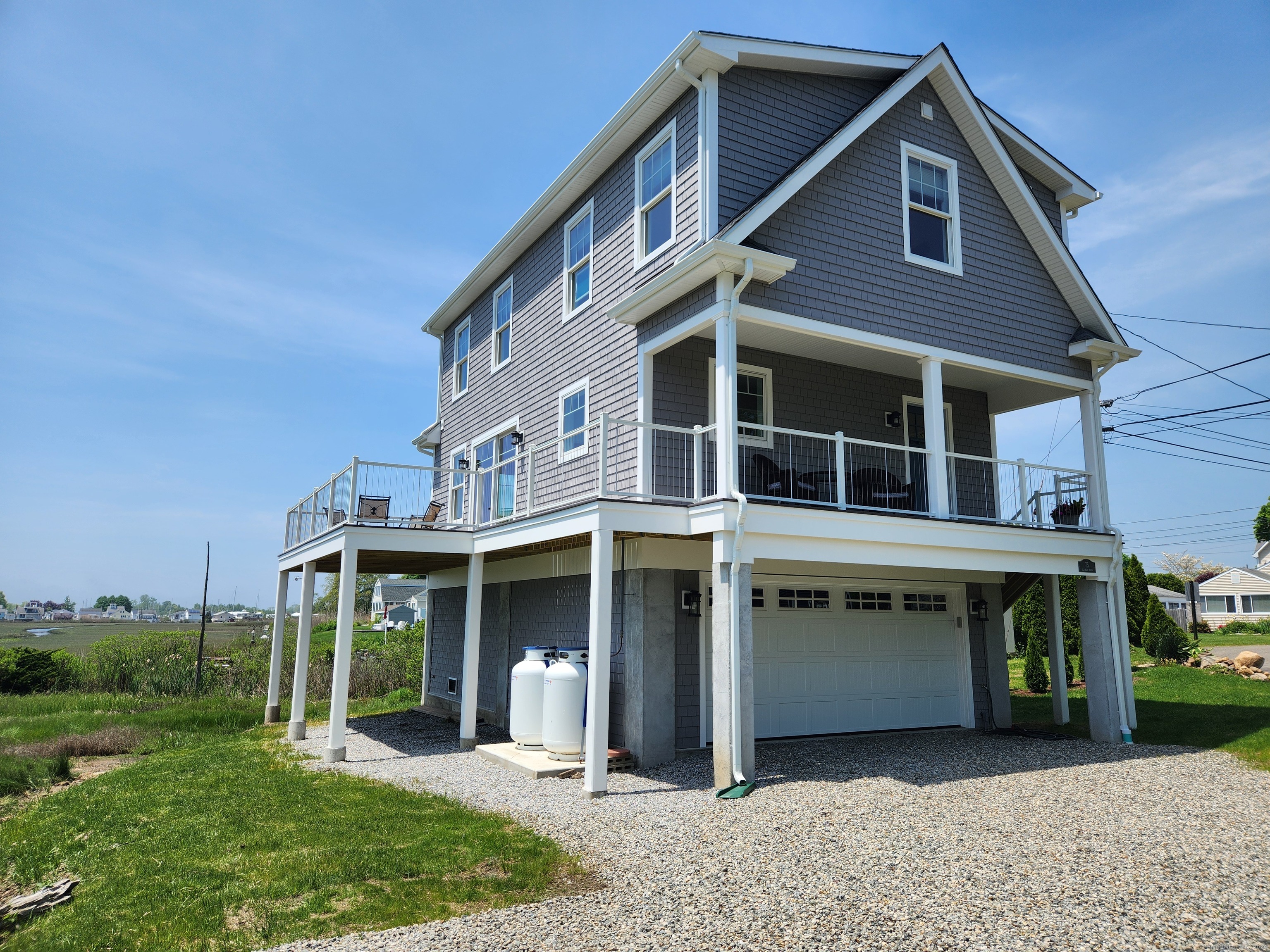 a view of a house with a yard and sitting space