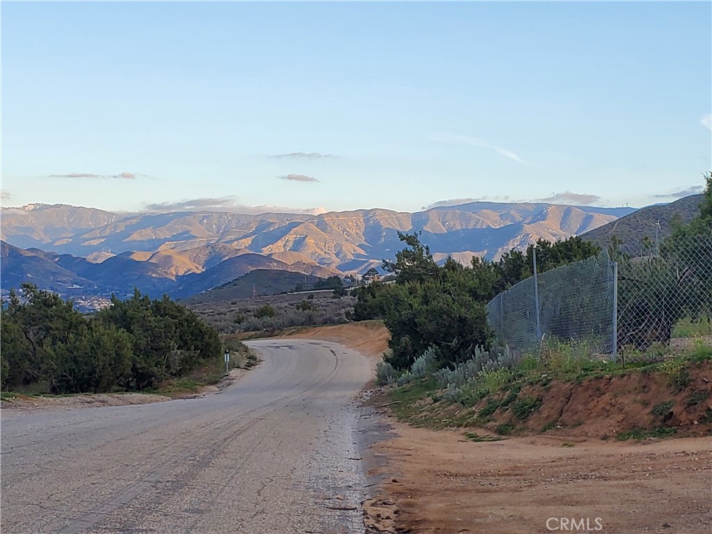 Street view at entrance to the property looking east