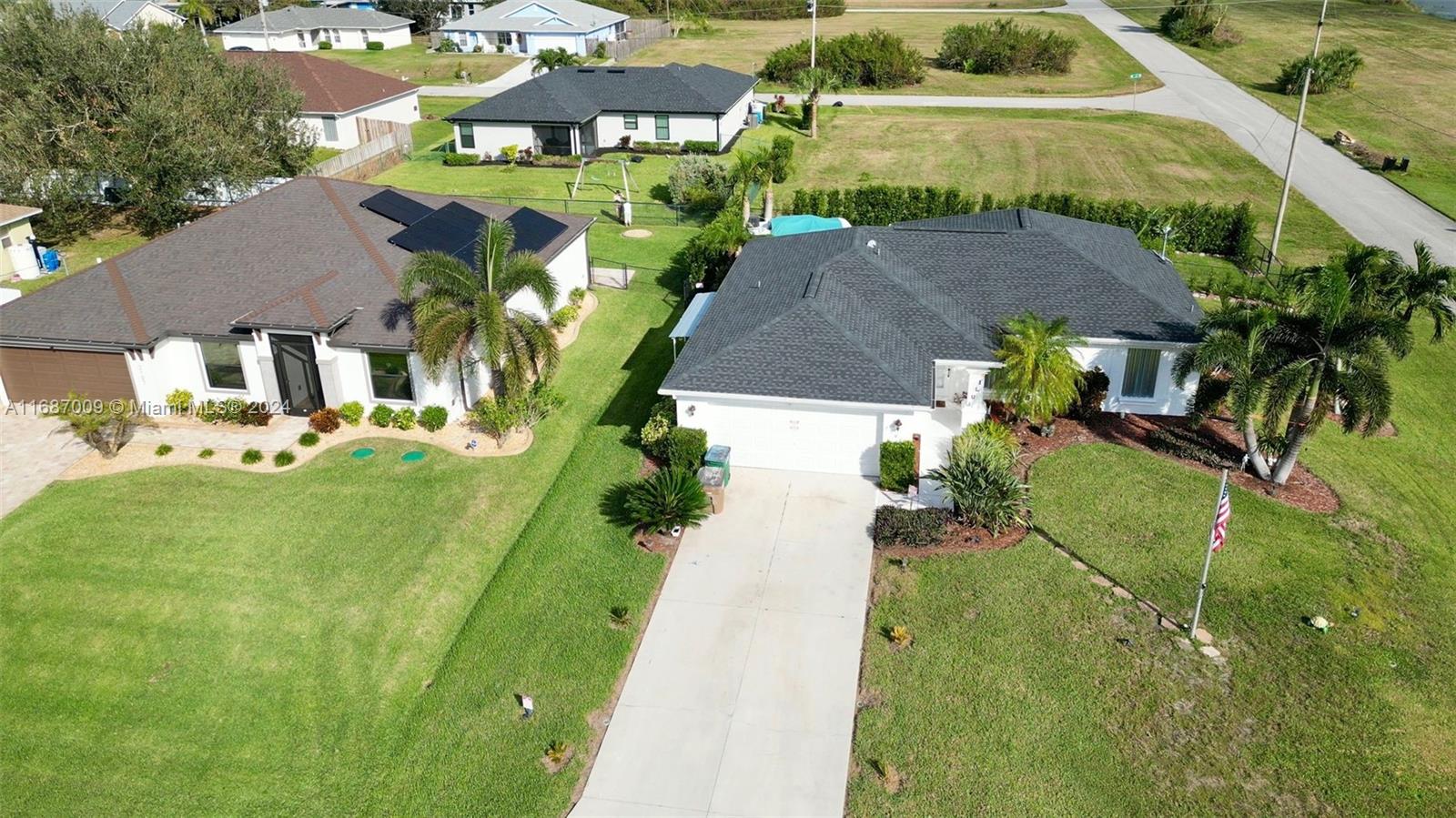 an aerial view of a house with a garden