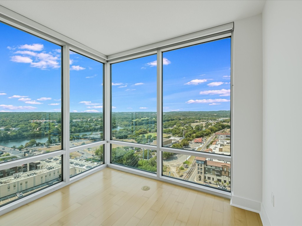 a view of an empty room with a large window