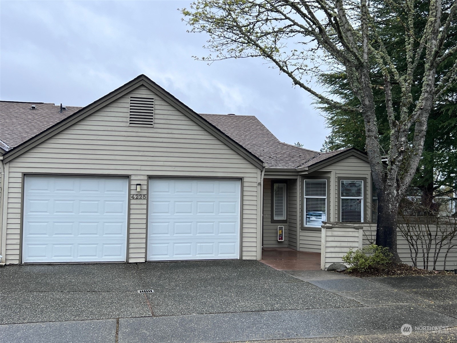 a front view of a house with garage