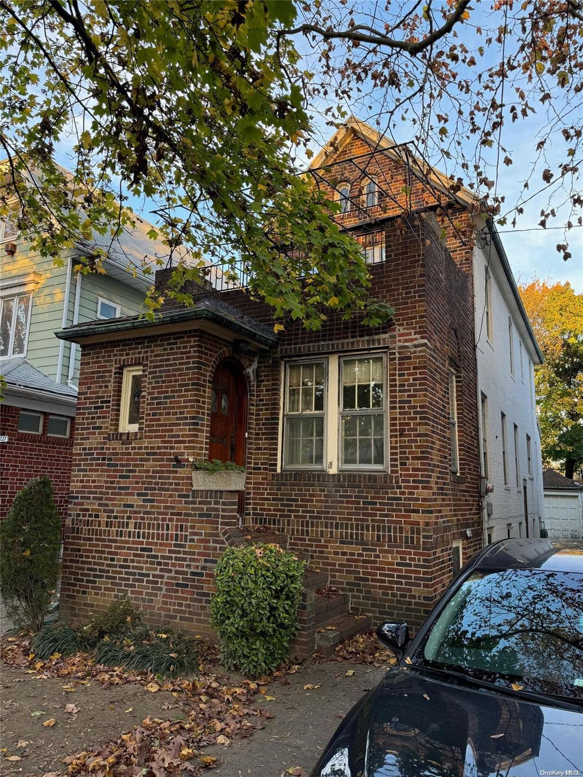 a front view of a house with yard