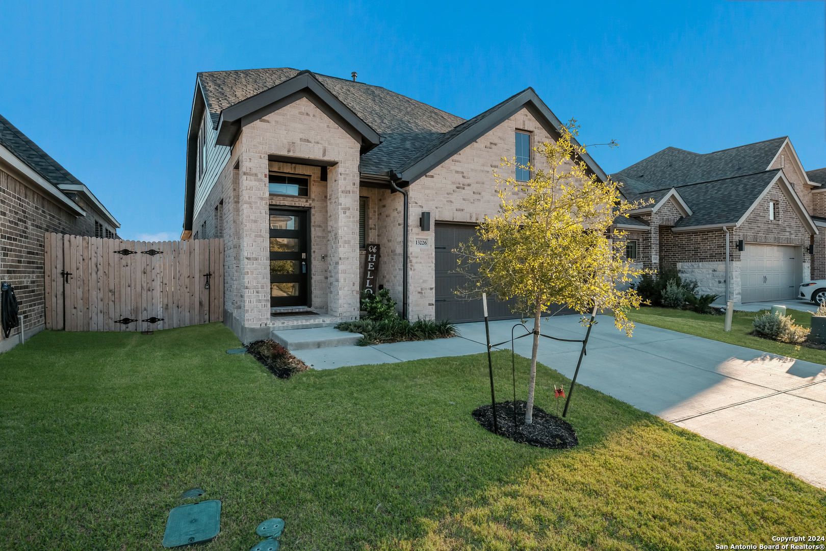 a front view of a house with a yard