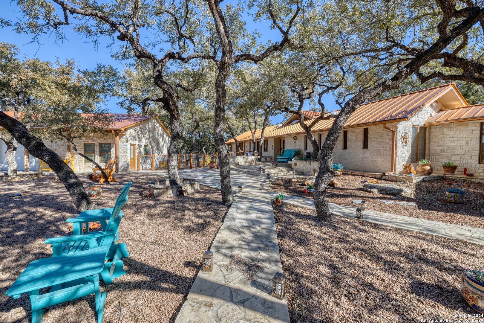 a view of a yard with a house and a tree