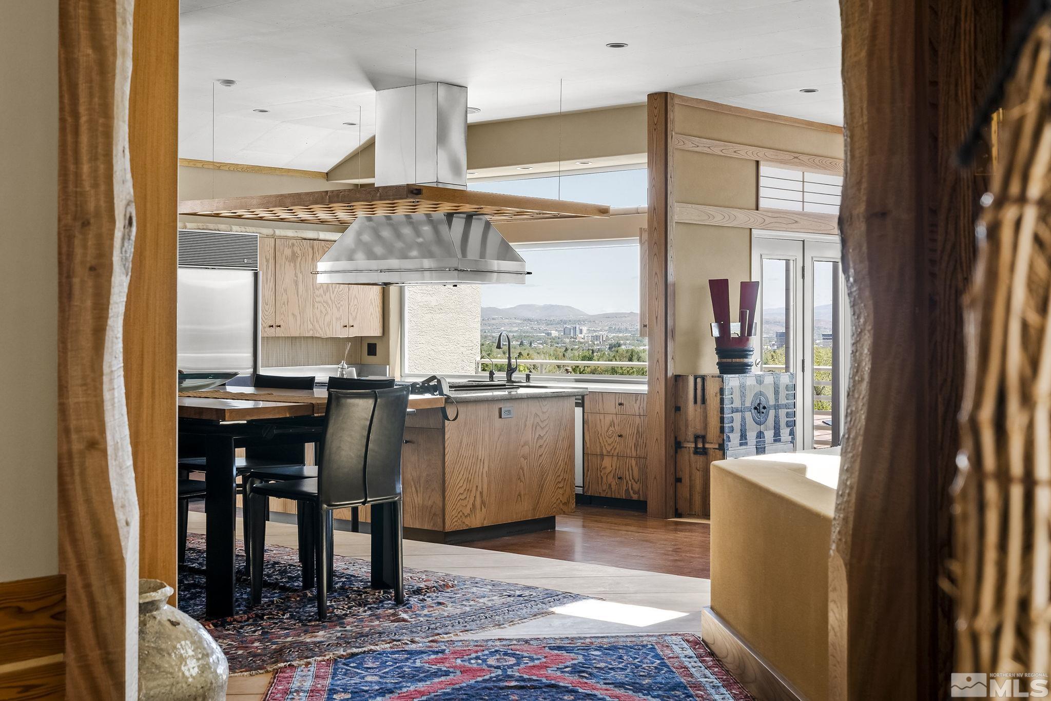 a kitchen with a table and chairs