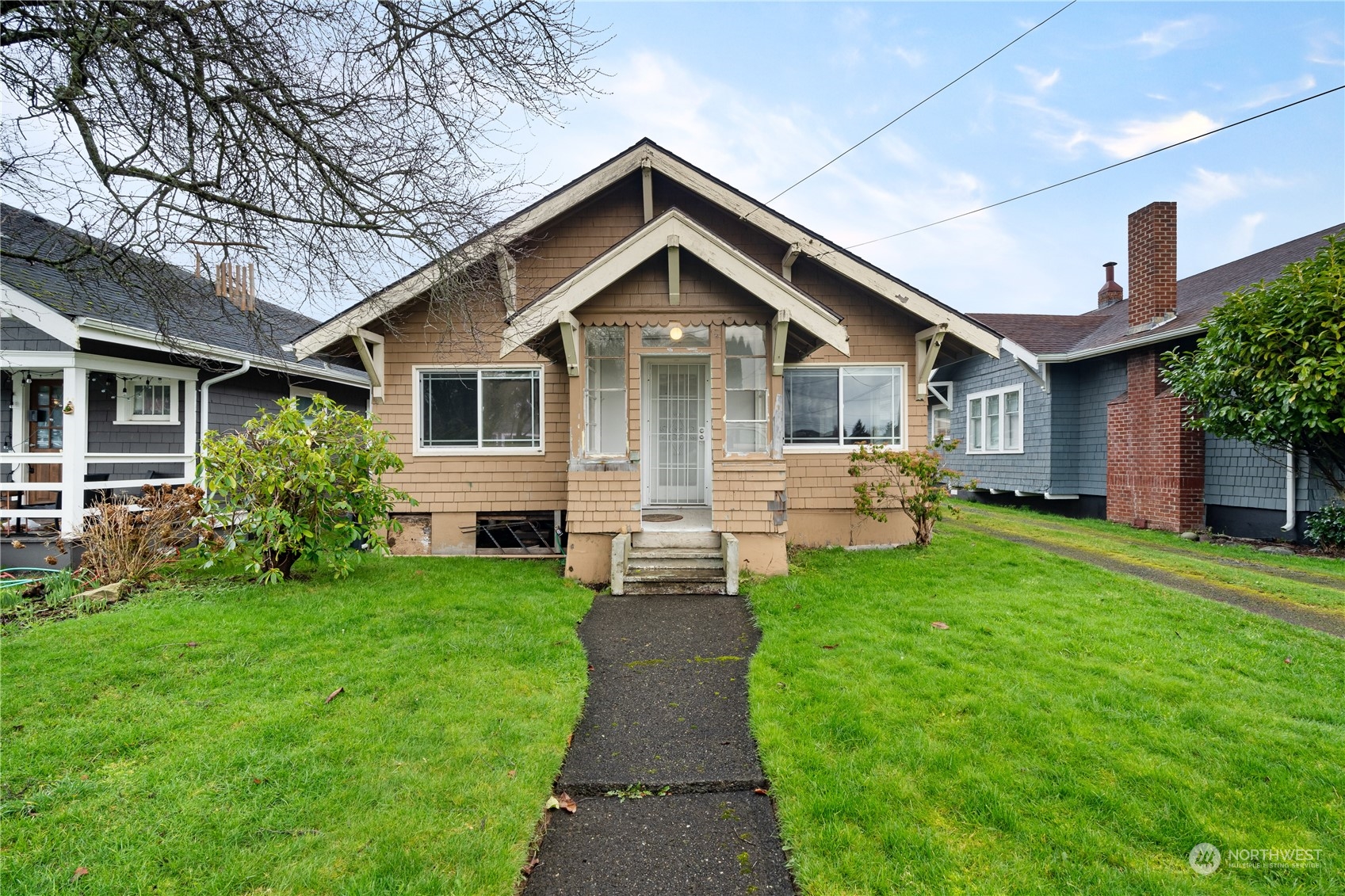 a front view of house with yard and green space