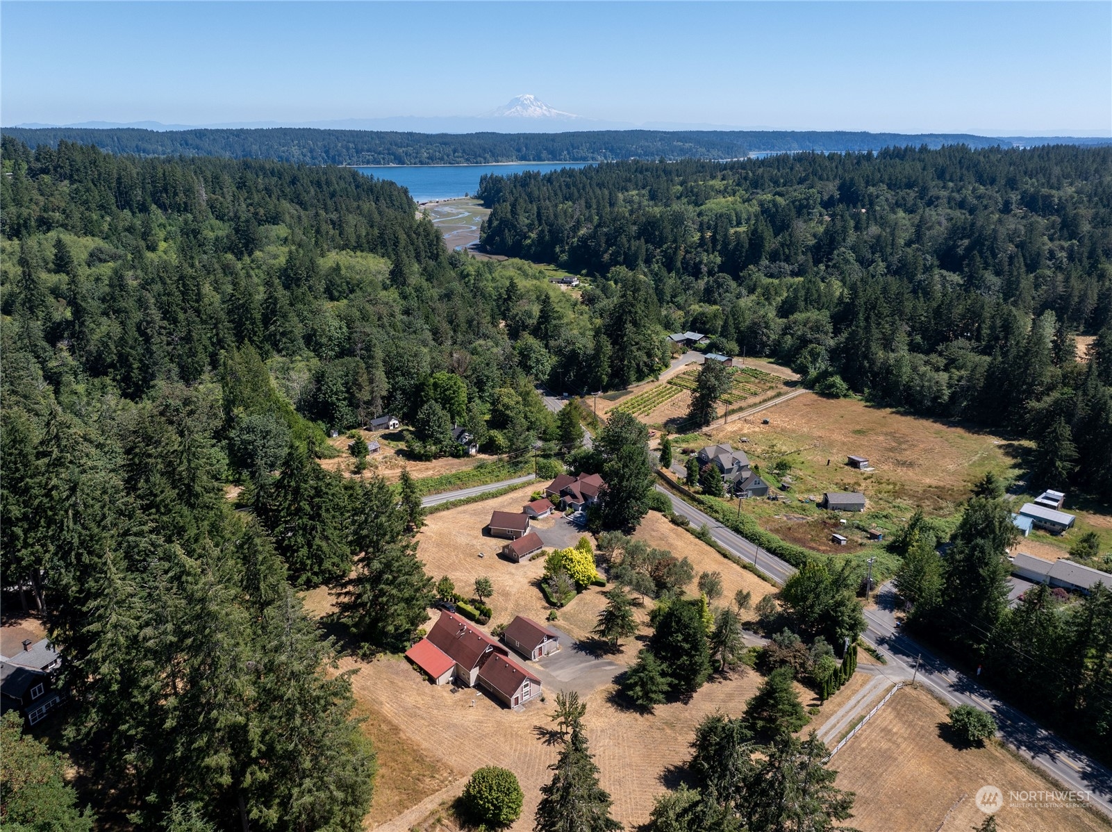 an aerial view of mountain with yard