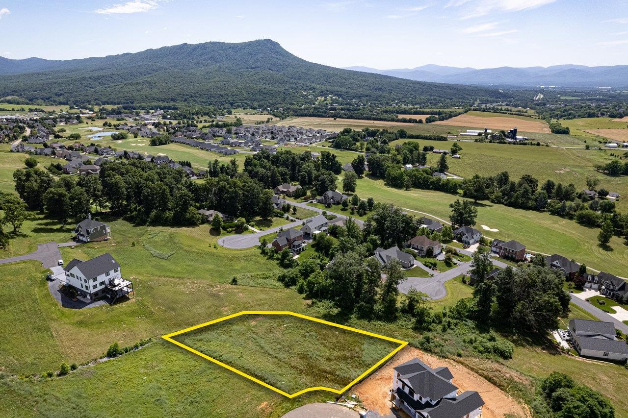 an aerial view of a residential houses and outdoor space