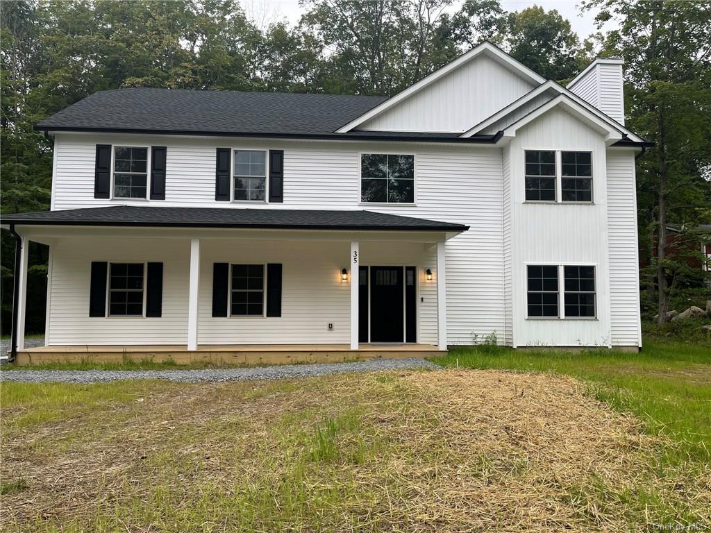 a house with yard in front of it