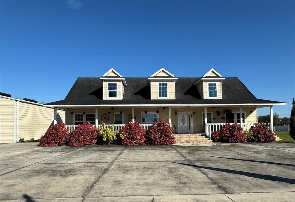 a front view of a house with lots of outdoor space