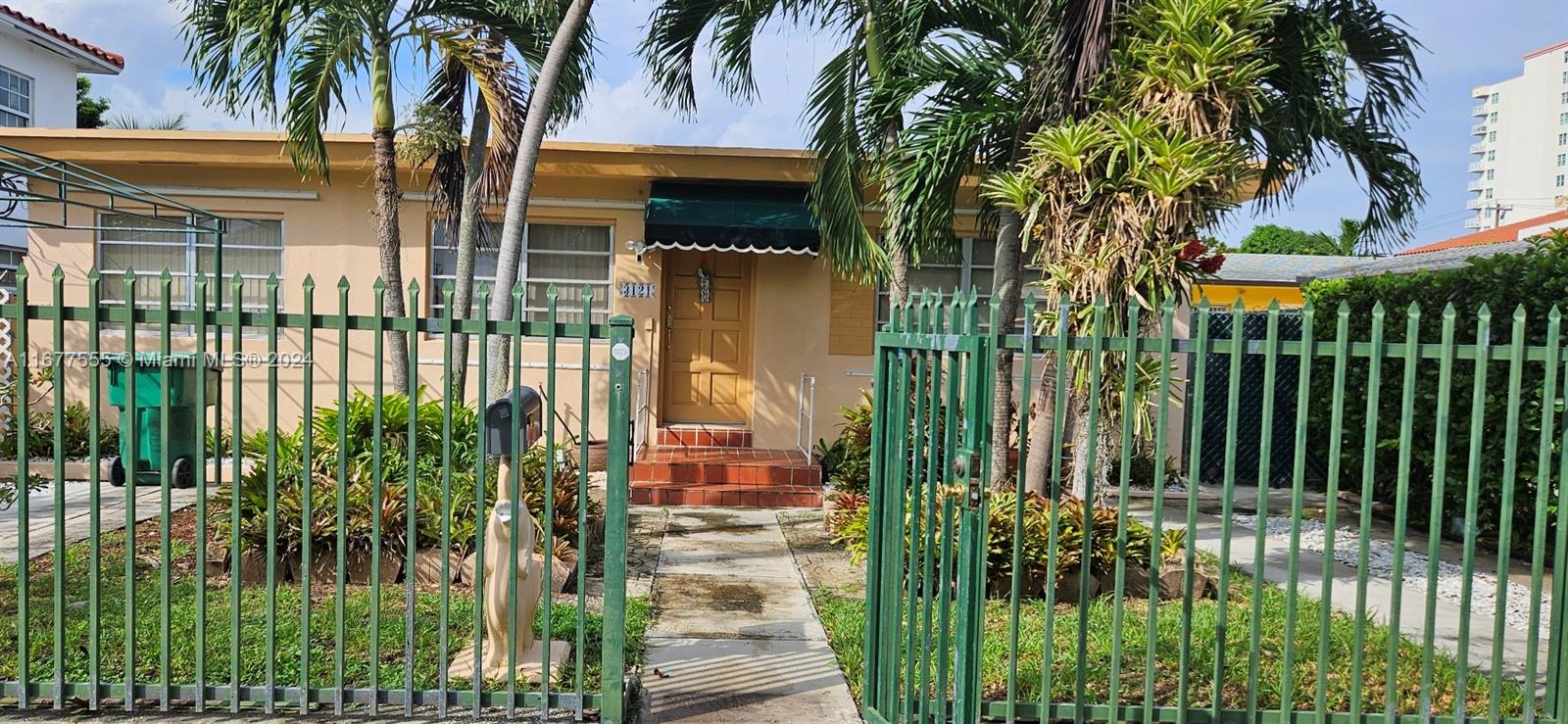 front view of a house with a garden