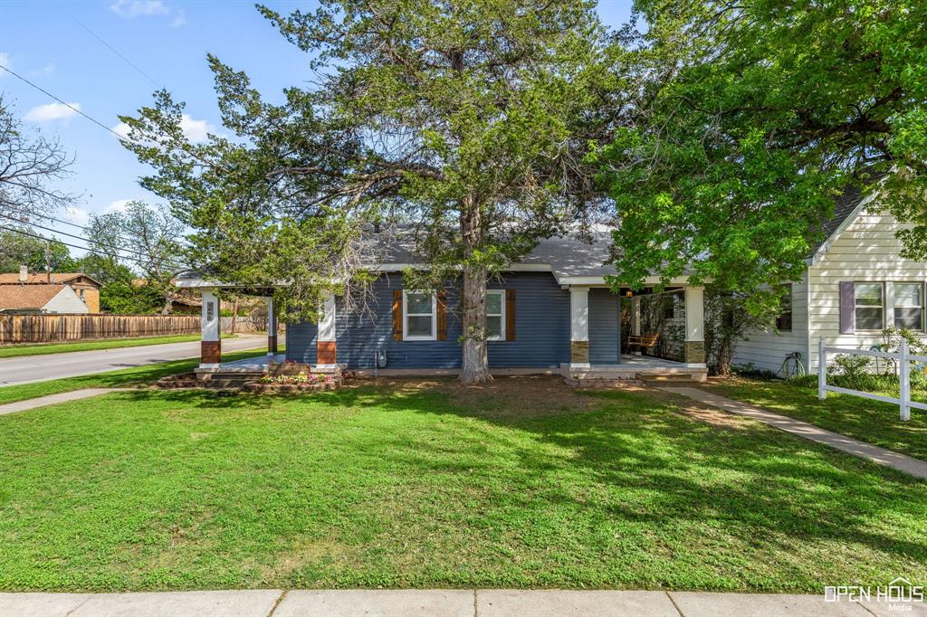 front view of a house with a yard