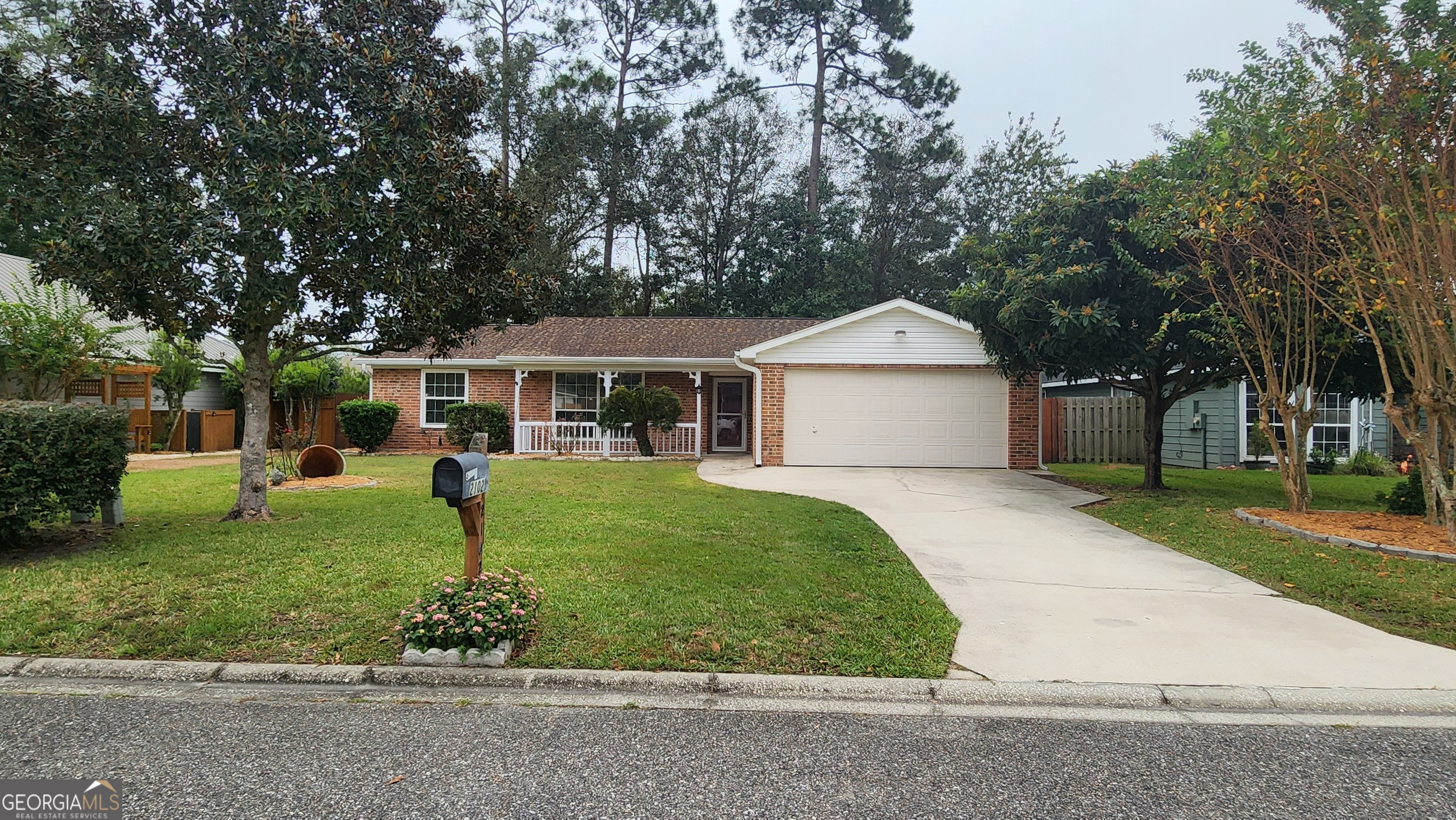 front view of a house with a yard