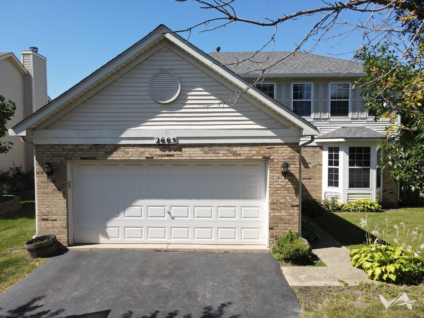 a front view of a house with a garage