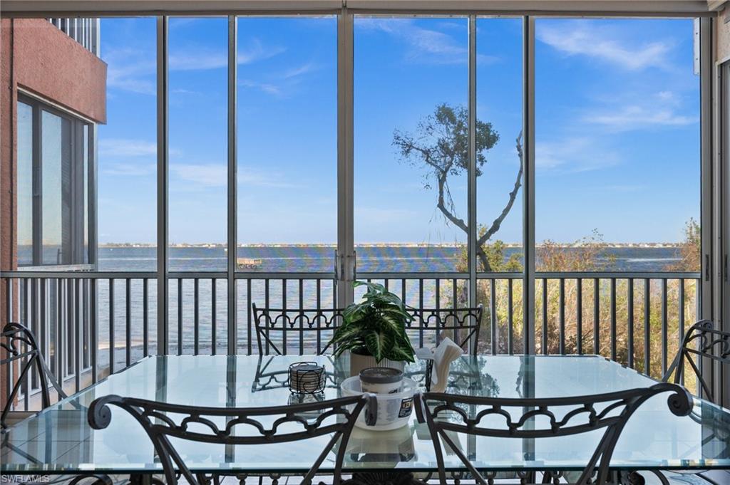 a view of a balcony with chairs