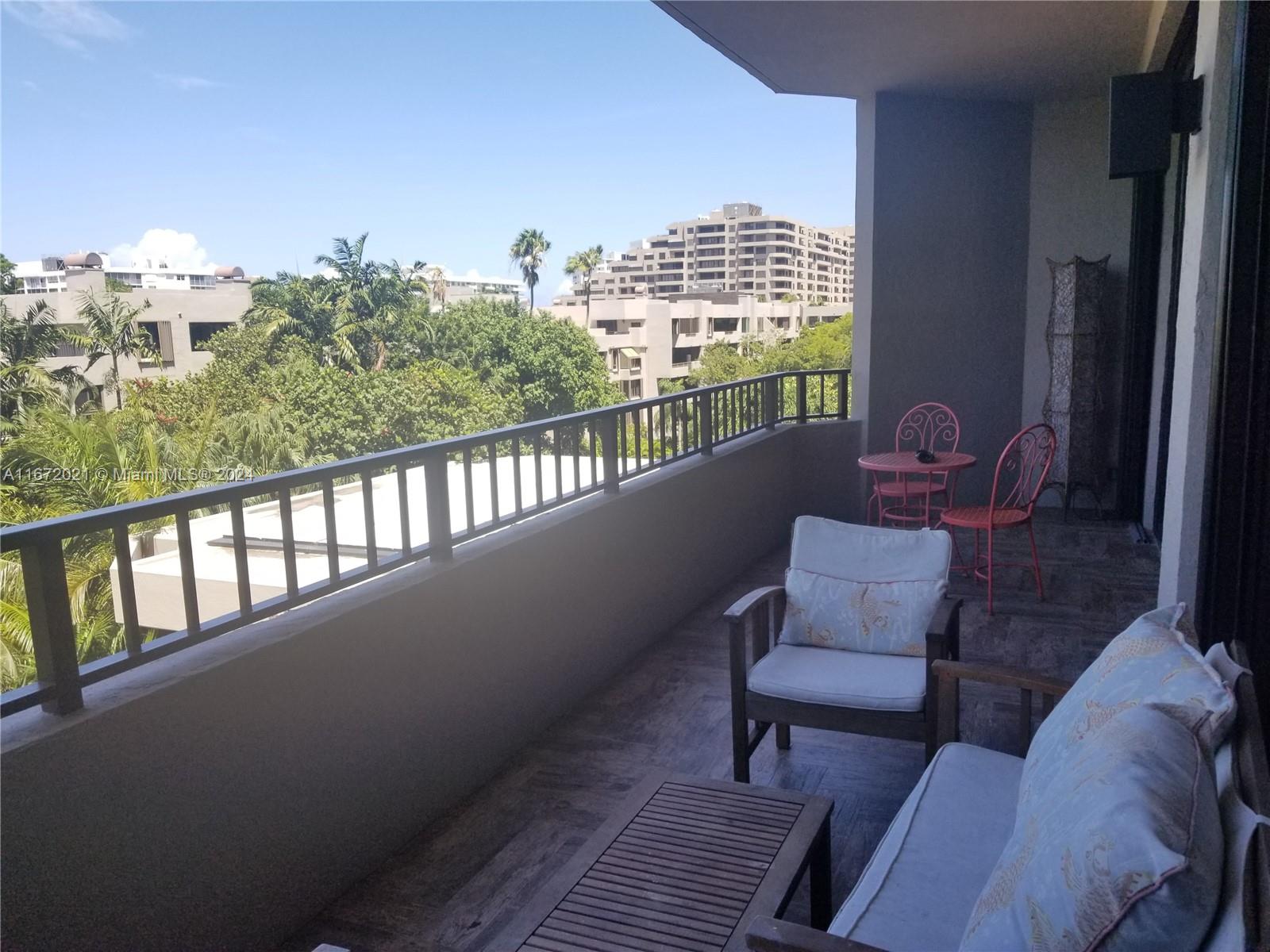 a view of balcony with furniture