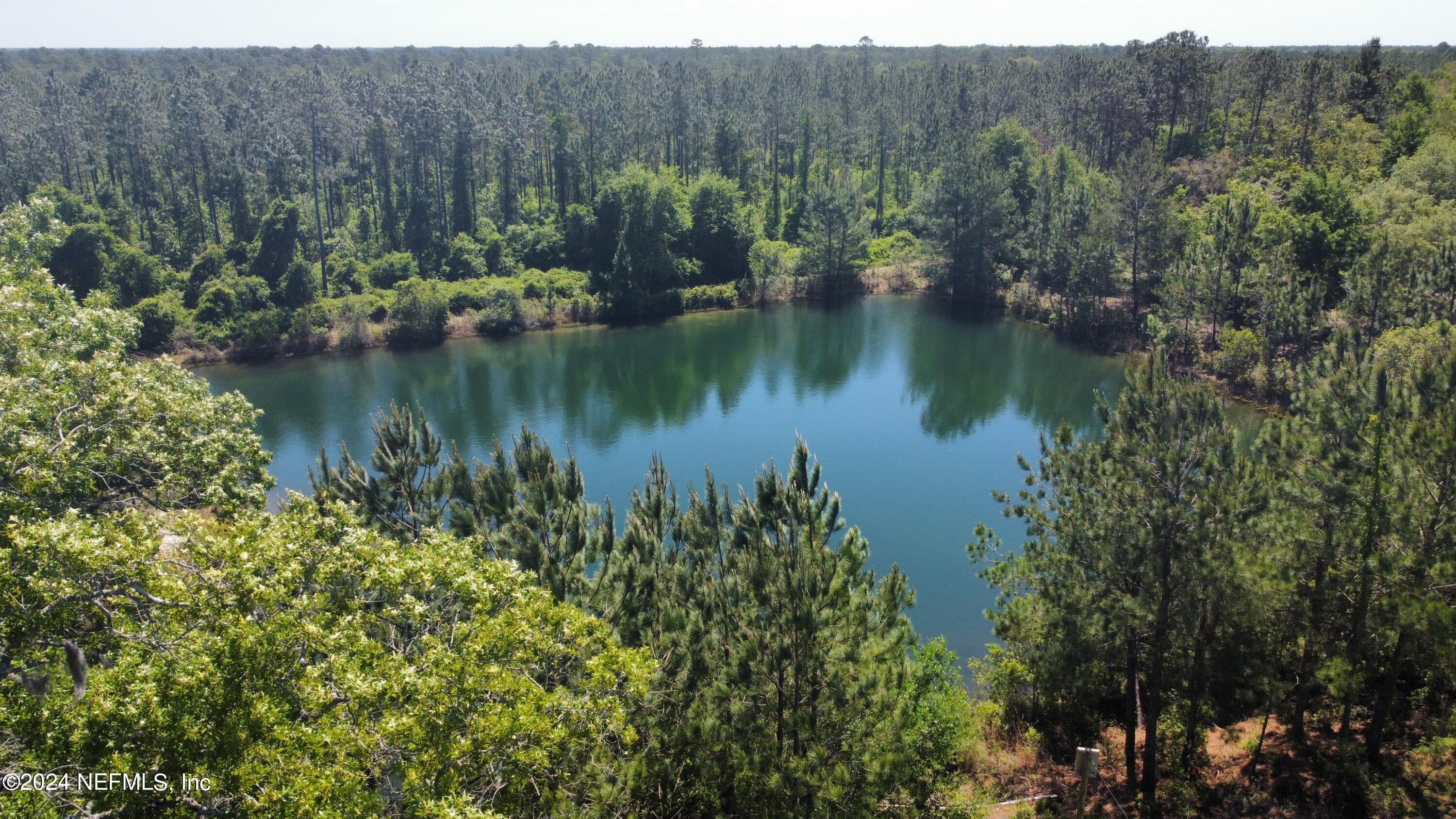 a view of lake with green space