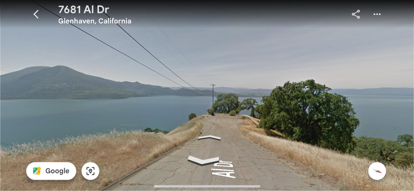 a view of a street with an ocean view