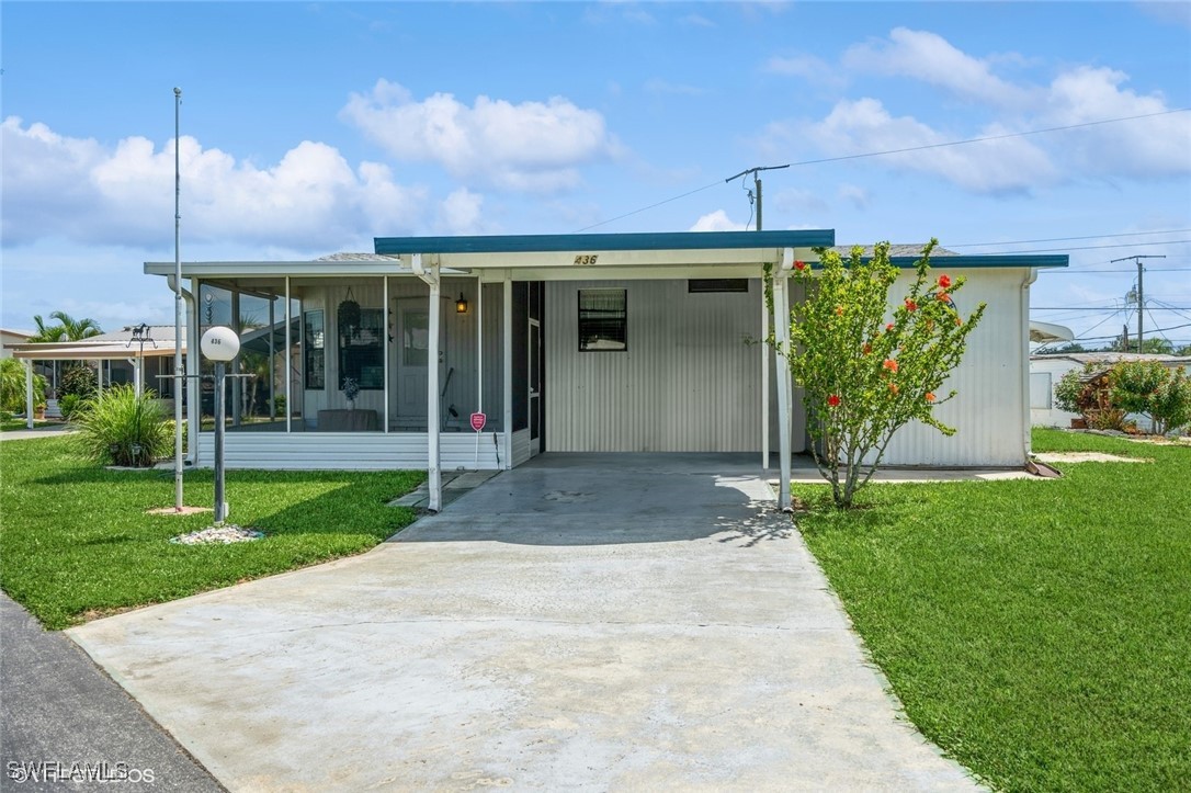 front view of a house with a yard