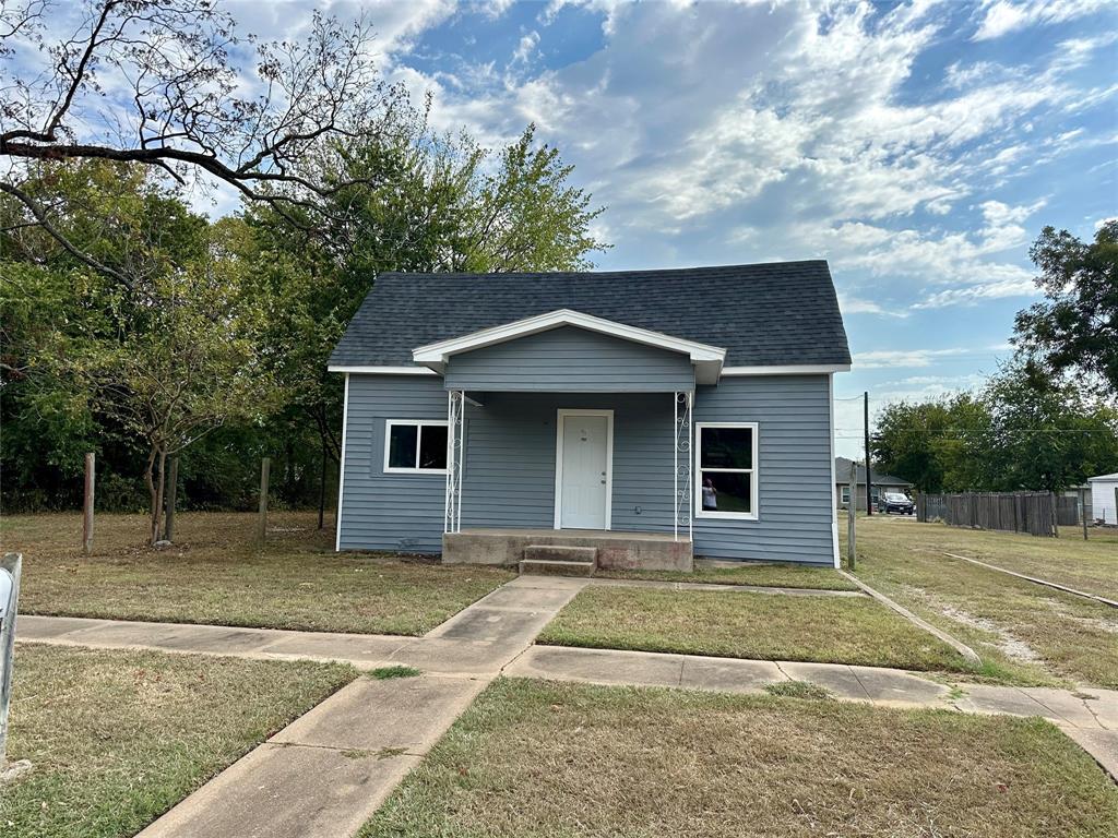 front view of a house with a yard