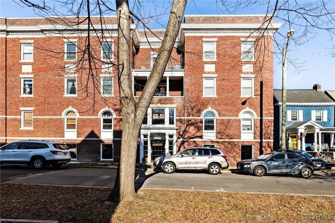 a car parked in front of a brick building