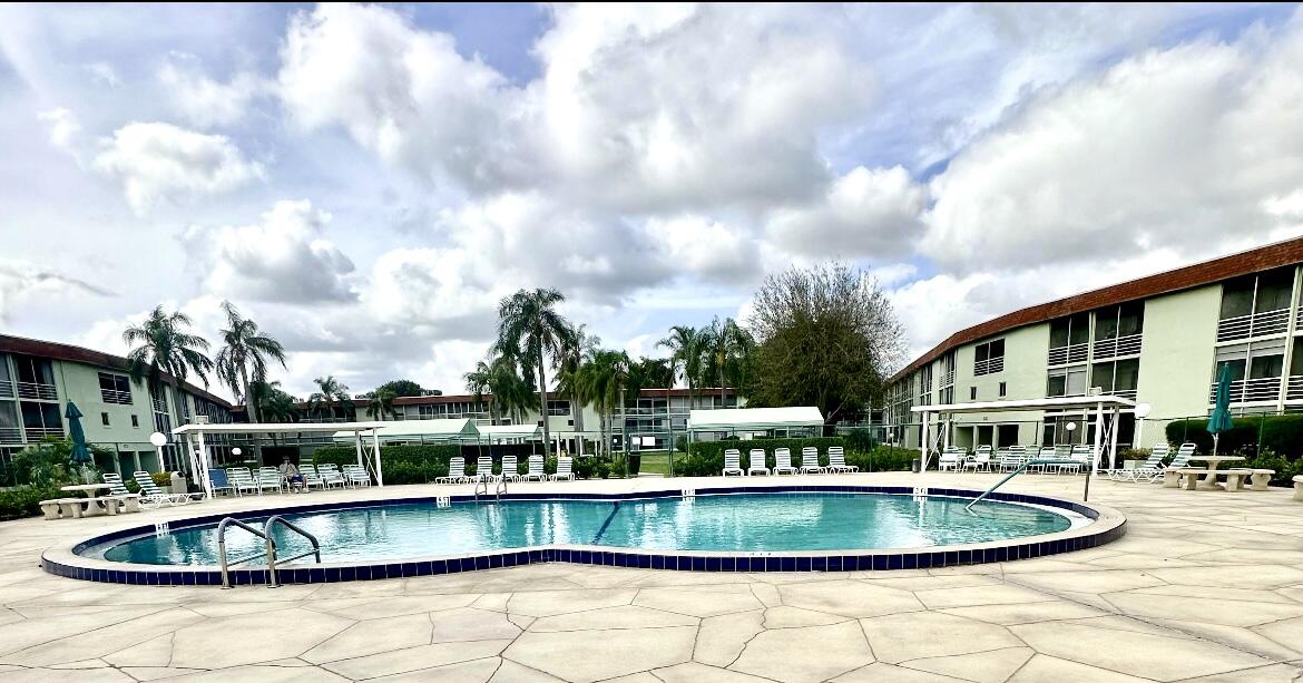 a view of a swimming pool with a patio