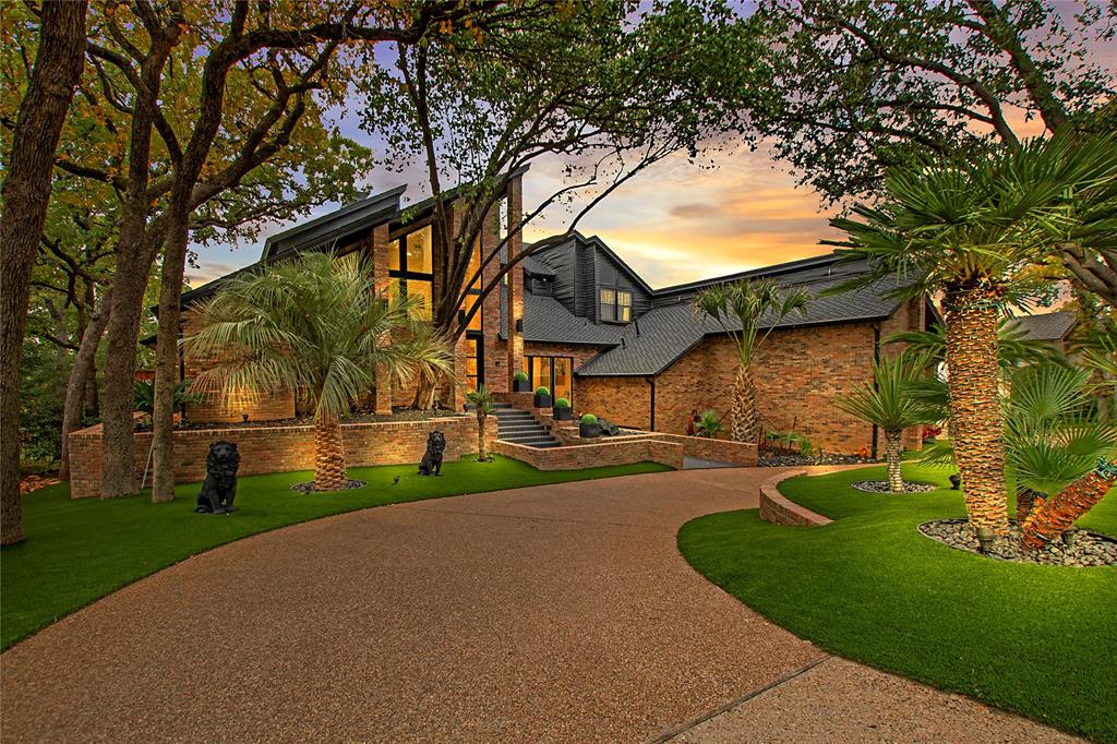 a view of house with a yard