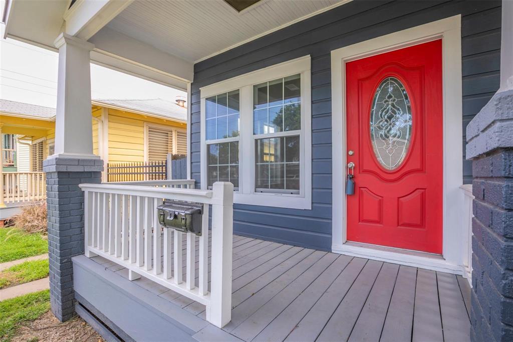 a view of a door and wooden floor