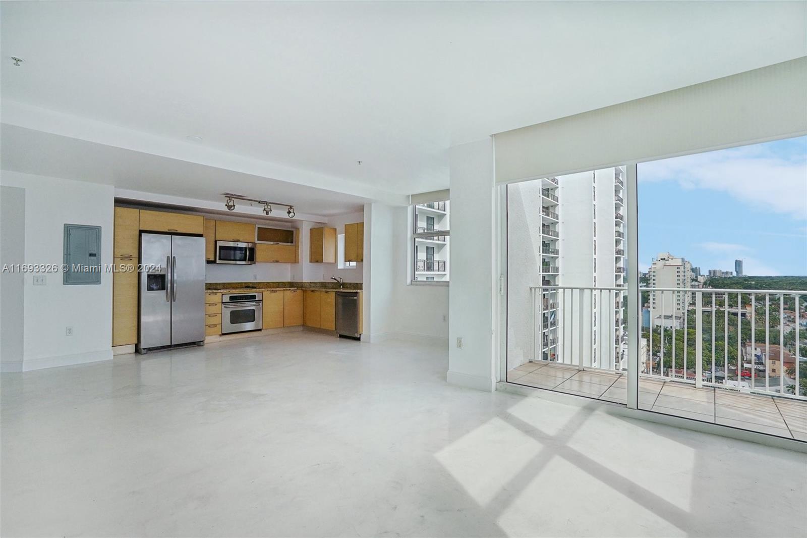 a view of an empty room with a balcony