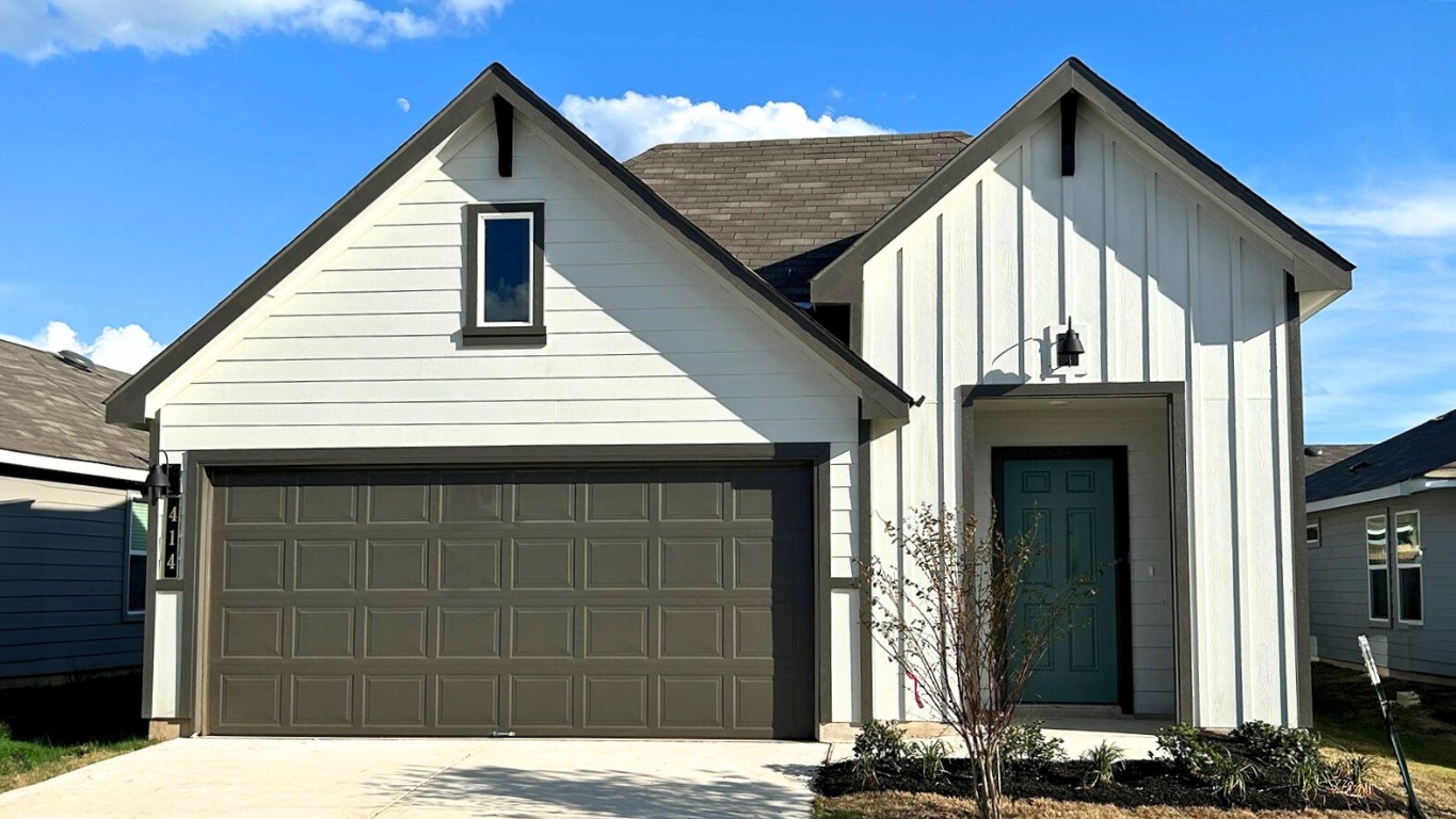 a view of house with front door