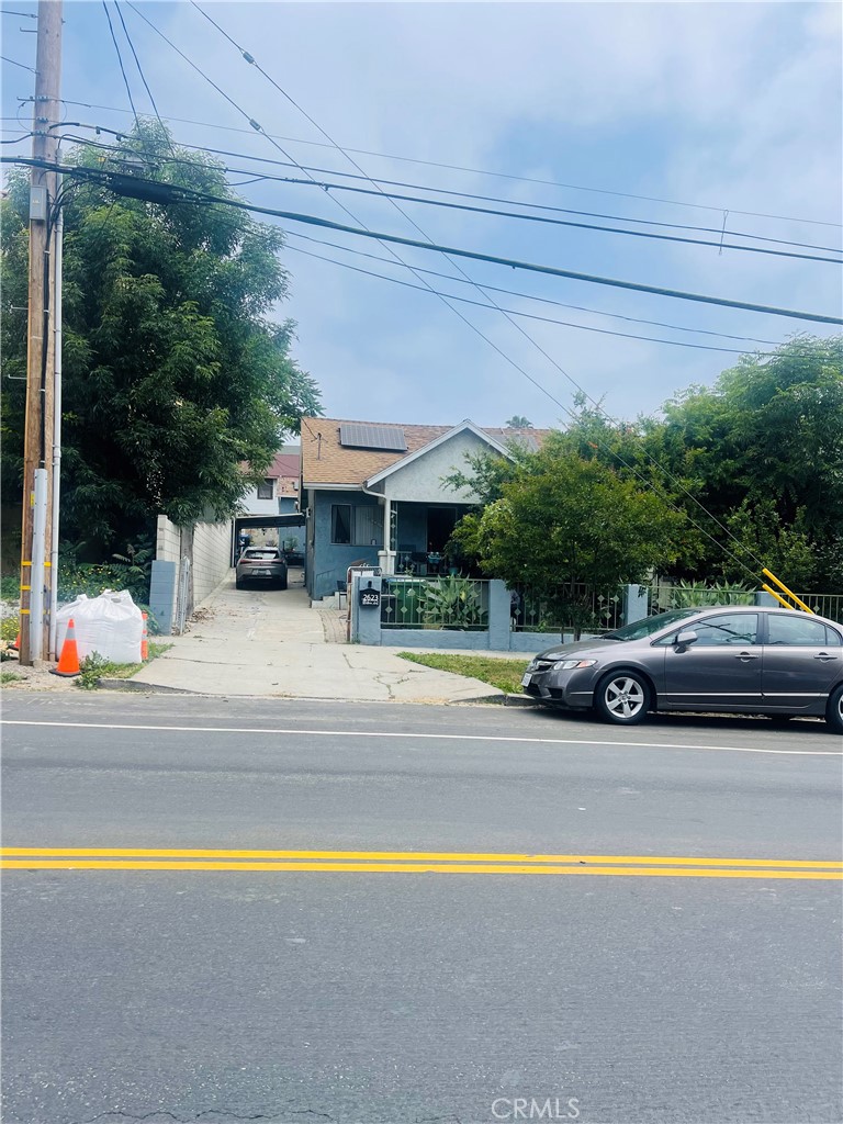 a view of street with parked cars