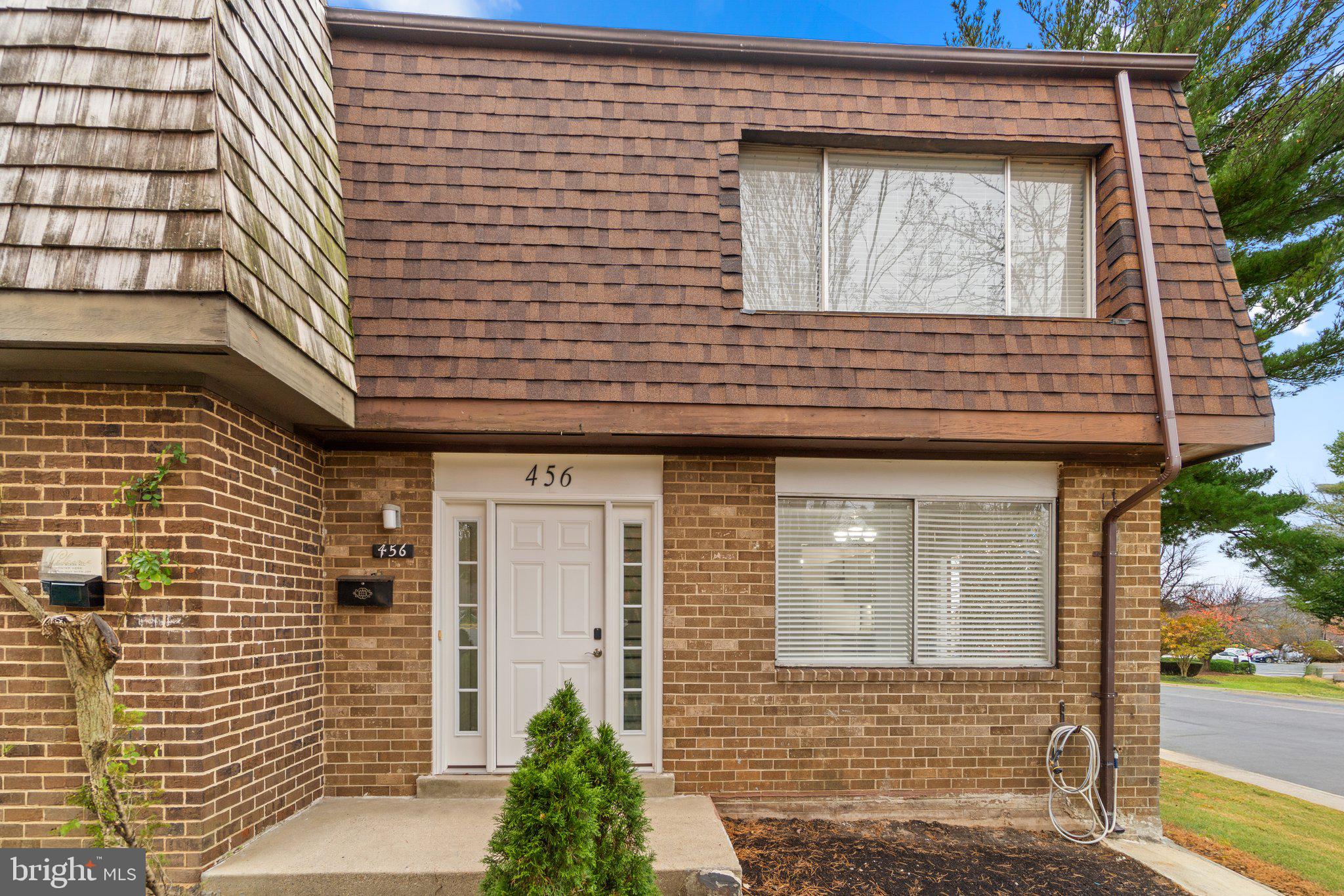 a view of a brick house with a door