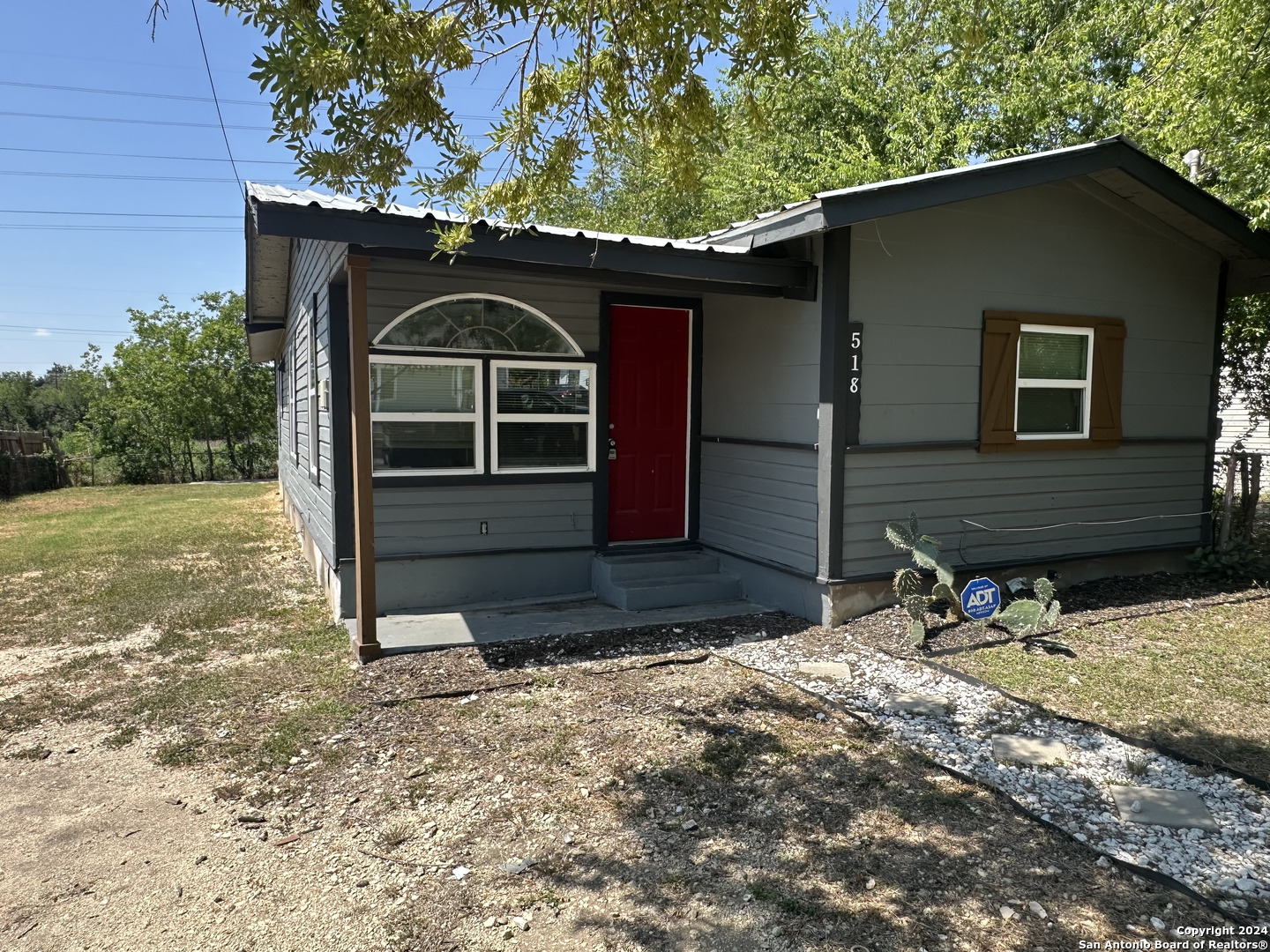 a front view of a house with parking space