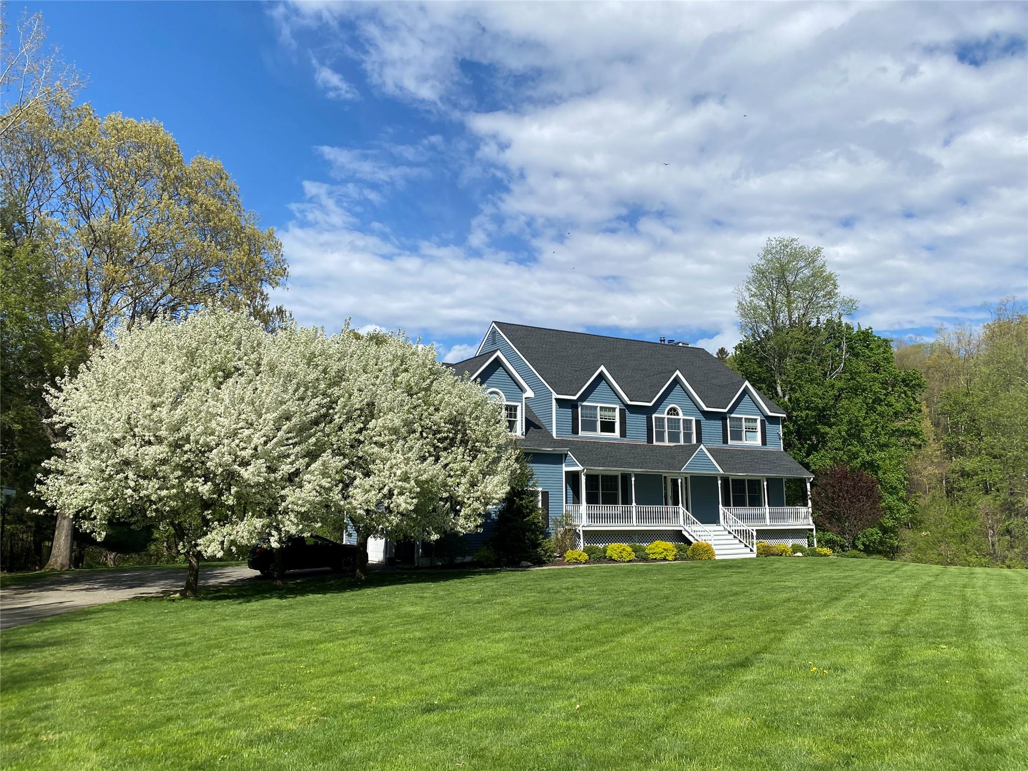 View of front featuring a front lawn and a porch