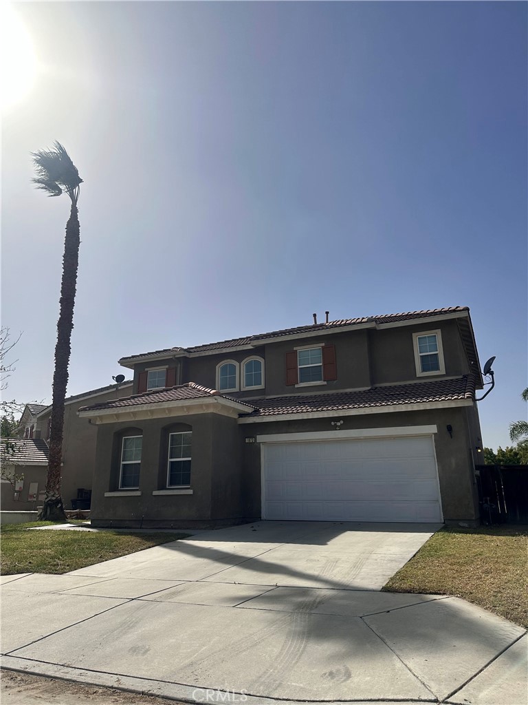 a front view of a house with a garage