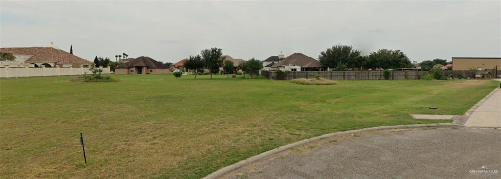 a view of outdoor space with garden and trees