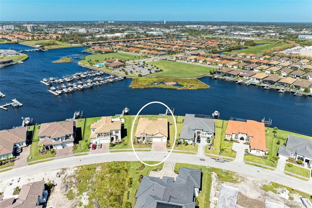 an aerial view of a house with a ocean view