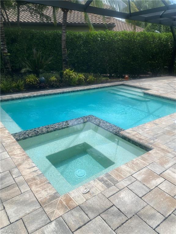 a view of a swimming pool and a yard