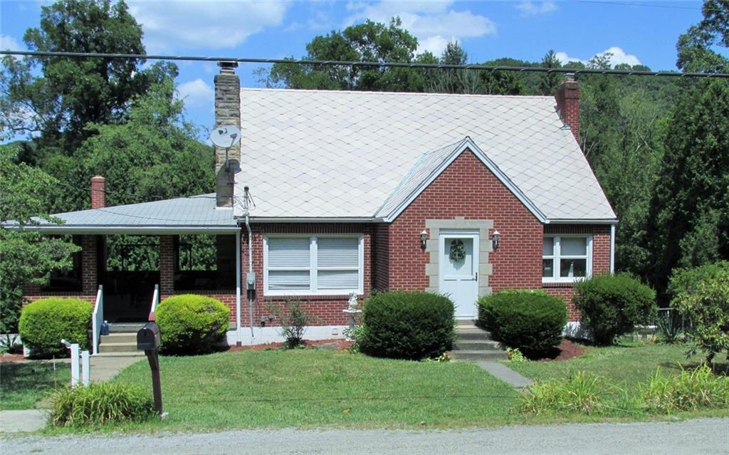 a aerial view of a house with yard and plants