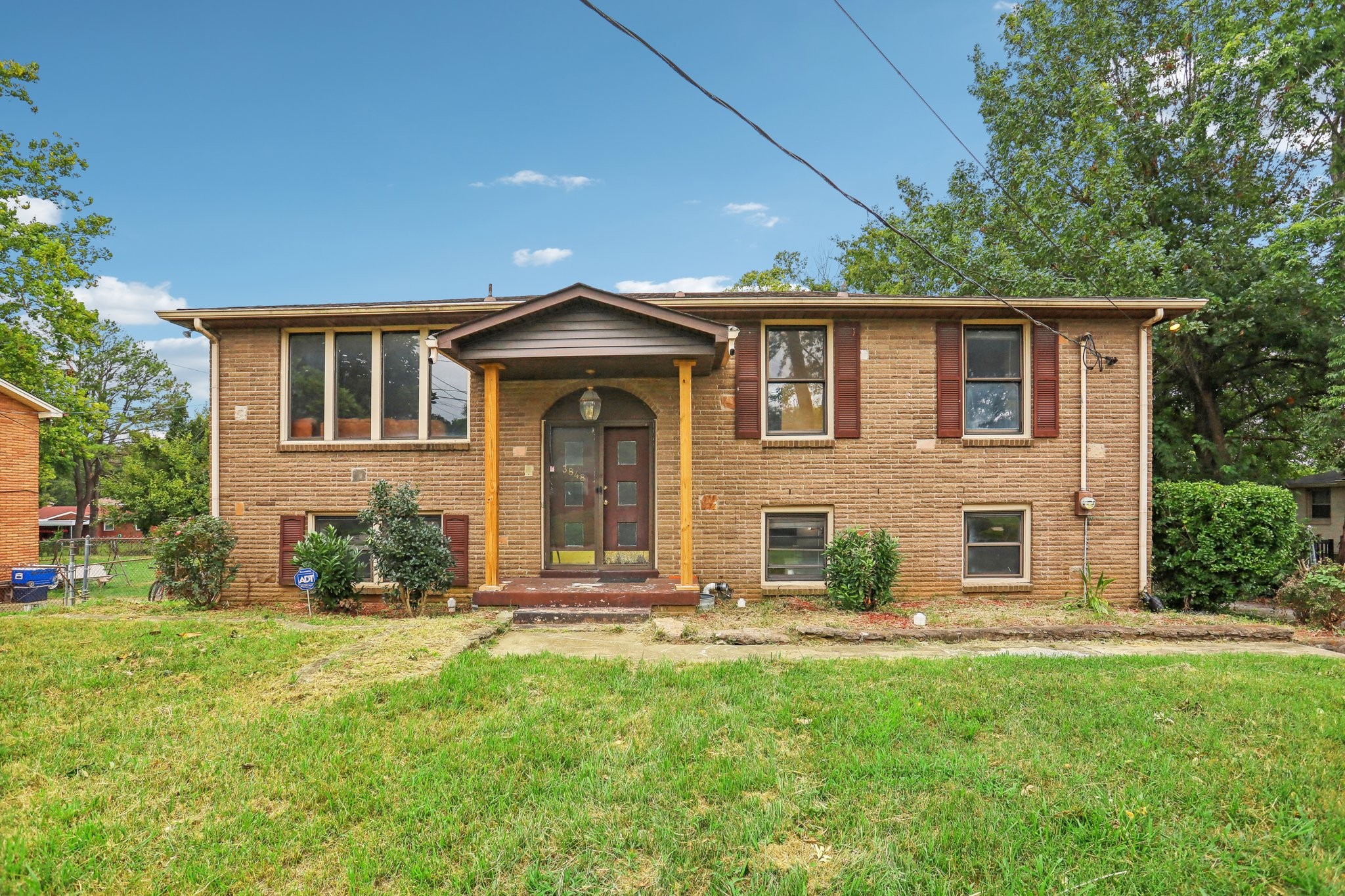 front view of a house with a yard