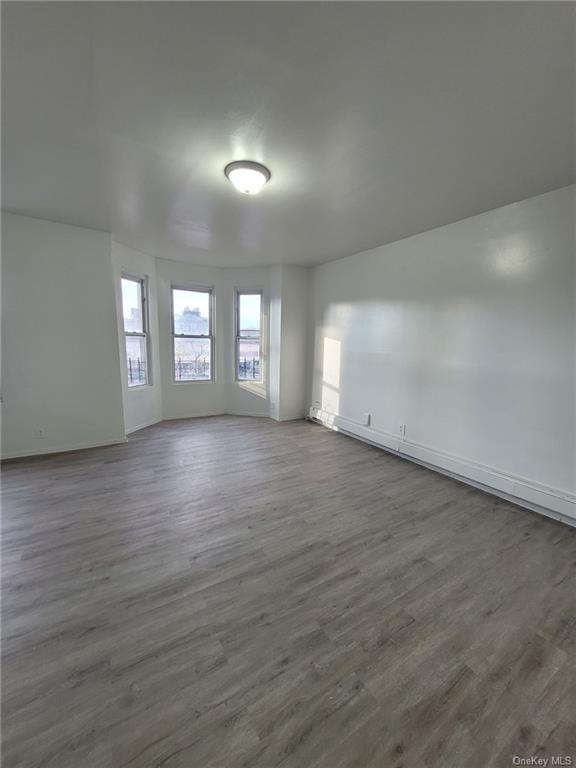 Living room with hardwood / wood-style floors