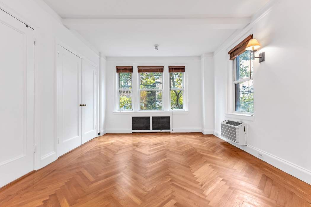 a view of an empty room with a window