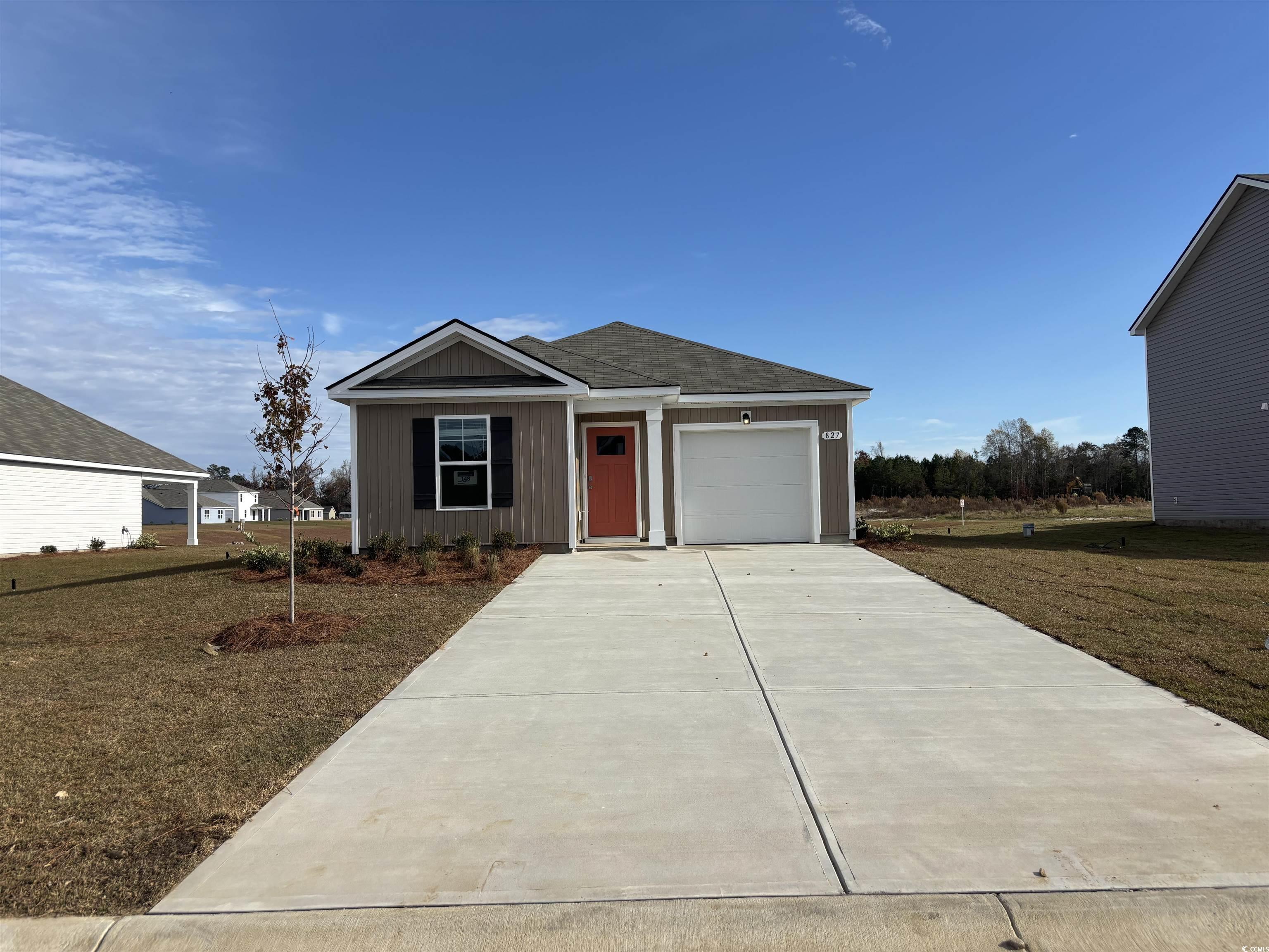 View of front of property with a front yard and a