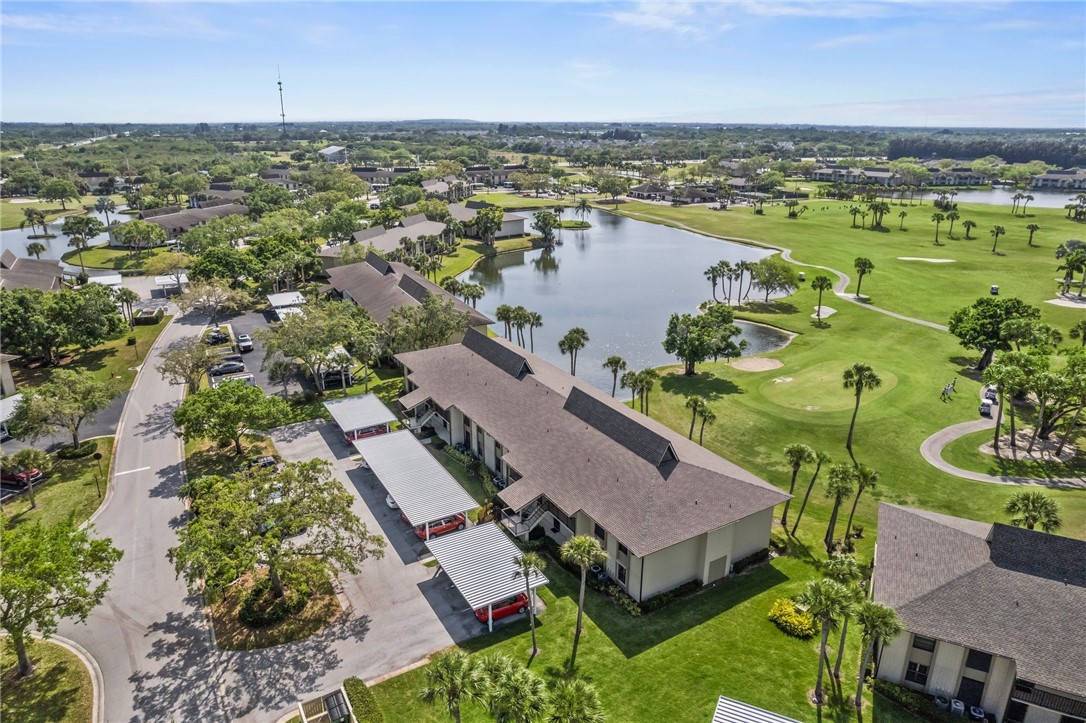 an aerial view of a house with a lake view