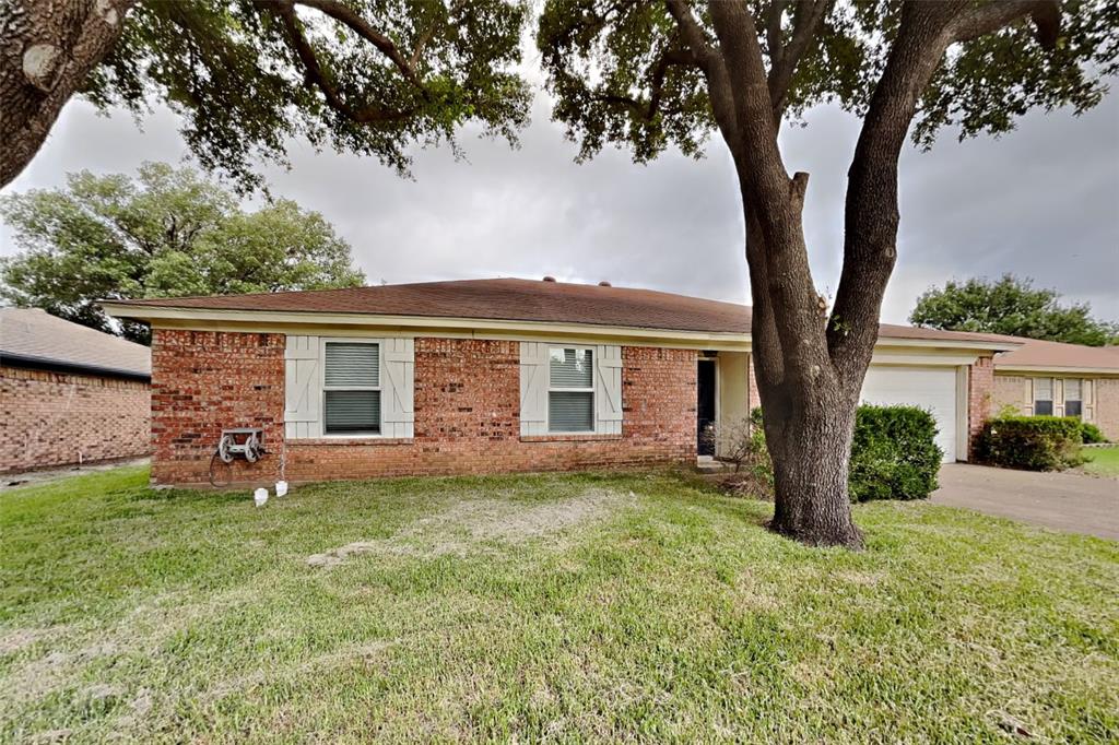 front view of a house with a yard